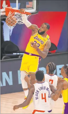  ?? Mike Ehrmann The Associated Press ?? Lebron James had 16 points, 11 rebounds and seven assists to help the Lakers move 6½ games ahead of the Clippers in the West with seven games left.