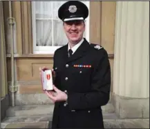  ??  ?? Andy Watt with his Queen’s Fire Service Medal, after he received it from Prince Charles at Buckingham Palace