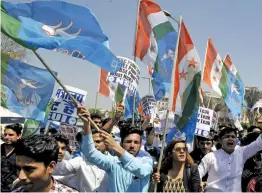  ?? — ASIAN AGE ?? NSUI activists and students raise slogans against Union HRD minister Prakash Javedkar regarding CBSE paper leak in New Delhi on Friday.
