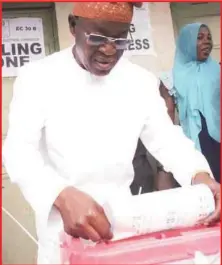  ??  ?? Oyetola of APC casting his vote at Boripe LGA