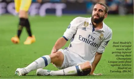  ?? EPA PIC ?? Real Madrid’s Dani Carvajal
reacts after getting injured during their Champions League semi-final against Atletico
Madrid on Tuesday.