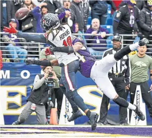  ?? KENNETH K. LAM TRIBUNE NEWS SERVICE ?? No flag was thrown when the Ravens’ Marlon Humphrey grabbed Texans receiver DeAndre Hopkins, leaving Bill O’Brien, whose coach’s challenge was denied, wondering what it takes to get a call.