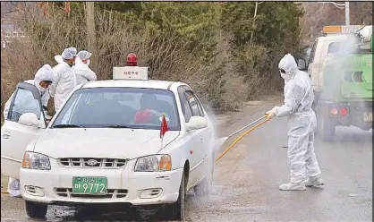  ?? REUTERS ?? South Korean health officials disinfect a vehicle to prevent the spread of bird flu in Pocheon, South Korea yesterday.