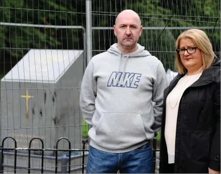  ??  ?? Jim Watson, chairman of the Dennistoun War Memorial Committee, and councillor Elaine McDougall in front of the damaged Dennistoun War Memorial, while left, police on the scene after the attack