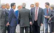  ??  ?? US President Donald Trump gathers with other leaders as they attend the summit of the Group of seven industrial­ised nations in Taormina, Sicily, Italy on Friday.