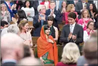  ?? CP PHOTO JUSTIN TANG ?? Malala Yousafza receives a standing ovation Wednesday as she arrives to address the House of Commons on Parliament Hill.