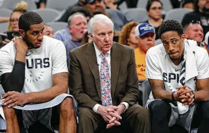  ?? Edward A. Ornelas / Getty Images ?? Drawbacks of the Spurs playing at Disney World with little chance of making the playoffs include the risk of older players such as LaMarcus Aldridge, left, and DeMar DeRozan, right, getting hurt and 71-year-old coach Gregg Popovich catching the coronaviru­s.