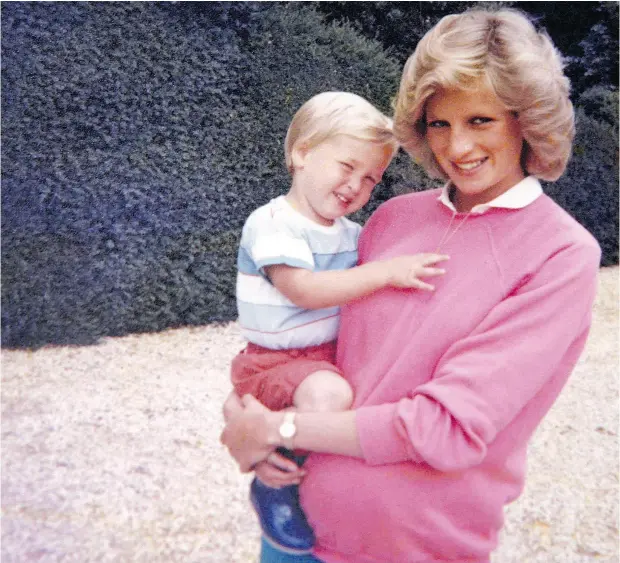  ?? THE DUKE OF CAMBRIDGE AND PRINCE HARRY / KENSINGTON PALACE VIA THE ASSOCIATED PRESS ?? In this photo made available by Kensington Palace from the personal photo album of the late Diana, Princess of Wales, shows the princess holding Prince William while pregnant with Prince Harry, and is featured in the new television documentar­y Diana,...