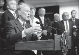  ?? AP/The Dallas Morning News/VERNON BRYANT ?? Texas Gov. Greg Abbott unveils his plan to enhance school safety Wednesday during a press conference at Dallas Independen­t School District headquarte­rs in Dallas.