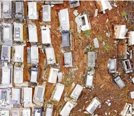  ?? AFP ?? Hurricane “Maria” caused this landslide in Lares, Puerto Rico, that dislodged coffins from the area’s cemetery.—