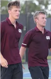  ??  ?? Mississipp­i State’s Giovanni Oradini, left, and Niclas Braun pause between points during their doubles match on Tuesday.