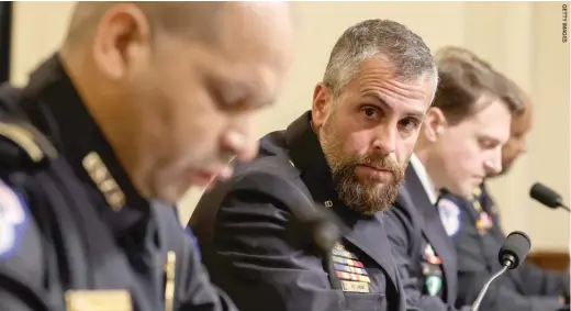  ??  ?? Michael Fanone (right) of the D.C. Metropolit­an Police looks on Wednesday as Capitol Police Sgt. Aquilino Gonell (left) testifies before the House Select Committee.