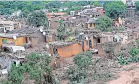  ?? African News Agency (ANA) | DOCTOR NGCOBO ?? BRANCHES, trees and mud lie on top of homes on a hill in Ntuzuma after mudslides.