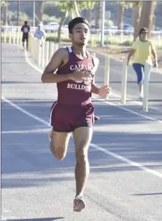  ?? PHOTO AARON BODUS ?? Calexico High’s Edgar Hurtado, glides towards the finish line Saturday morning at Cattle Call Park. Hurtado, a senior, won the boys varsity race at the IVL season-opening meet with a time of 17:27.8.