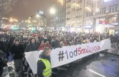  ?? REUTERS ?? Demonstrat­ors march during a protest against Serbian President Aleksandar Vucic and his government in central Belgrade.