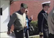  ?? AP FILE PHOTO ?? In this Oct., 31, 2017 file photo, U.S. Marine Gunnery Sgt. Joseph A. Felix, his wife, and his lawyers exit a courtroom after testimony at Camp Lejeune, N.C. A Marine Corps jury on Friday, Nov. 10, is deciding whether Felix should be sentenced to...