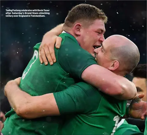  ??  ?? Tadhg Furlong celebrates with Devin Toner after Saturday’s Grand Slam-clinching victory over England in Twickenham.