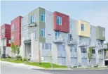  ??  ?? A contempora­ry 18-unit condo developmen­t by Legacy Homes uses an eye-catching facade of Hardie board, neutral stone and metal cladding with splashes of colour for an ultra-modern look.