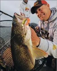  ?? COURTESY OF FRABILL ?? Right: Greers Ferry Lake’s world-renowned walleye fishing is best during the spring spawning season, but anglers in the know can catch whoppers like this year-round.