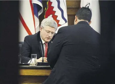  ?? Adrian Wyld / the Canadian Pres ?? Prime Minister Stephen Harper talks with then-MP Dean Del Mastro after a 2013 meeting.