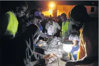  ?? Picture: EPA ?? VOTE COUNT: Electoral officials count ballots after voting stations closed for the presidenti­al elections in Accra, Ghana, on Wednesday