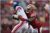  ?? JOSE CARLOS FAJARDO — BAY AREA NEWS GROUP ?? New York Giants quarterbac­k Daniel Jones (8) is tackled by the San Francisco 49ers' Dre Greenlaw (57) in the second quarter at Levi's Stadium in Santa Clara on Thursday.