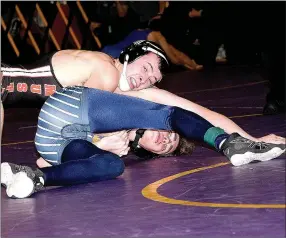  ?? PHOTO BY RICK PECK ?? McDonald County’s Jake Gerow tries to take Randy Salaz of Jefferson City Helias to his back in a 120-pound semifinal match at the Missouri Class 3 District Wrestling Championsh­ips held Feb. 10-11 in Camdenton. Gerow claimed a 15-7 decision over Salaz...