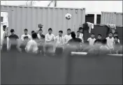  ?? ASSOCIATED PRESS ?? IN THIS DEC. 10, 2018, photo, immigrant boys play soccer at the Homestead Temporary Shelter for Unaccompan­ied Children, a former Job Corps site that now houses them in Homestead, Fla.