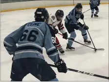  ?? ANDREW ROBINSON/MEDIANEWS GROUP ?? North Penn’s Ryan Cunningham (47) and Zachery Cline (66) trap a Souderton skater on Thursday night.