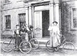  ?? MOUNT ALLISON ARCHIVES ?? Elenor Wood and two friends with their bicycles in front of the entrance to her parents’ home, Cranewood, sometime before her wedding to Frank Bunting Black in 1879-1898.