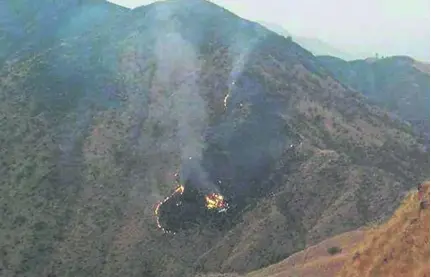  ?? EPA ?? Flaming debris from the Pakistan Internatio­nal Airlines plane, which crashed near Abbottabad in northern Pakistan.