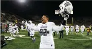  ?? AP PHOTO BY CHARLIE NEIBERGALL ?? Northweste­rn defensive lineman Fred Wyatt celebrates after his team defeated Iowa 14-10 Saturday, Nov. 10, in Iowa City, Iowa.