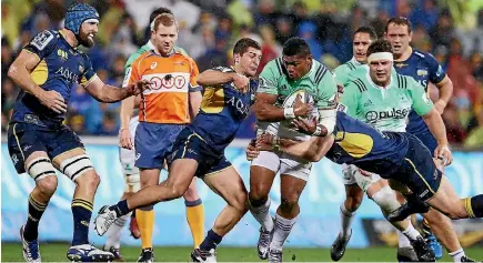  ?? PHOTO: GETTY IMAGES ?? Waisake Naholo heads upfield as the Brumbies tacklers hold on during last night’s Super Rugby quarter-final match in Canberra.