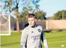  ?? JULIA POE/PRO SOCCER USA ?? Orlando City forward Chris Mueller warms up during the Lions’ first preseason training of the year on Monday in Kissimmee.