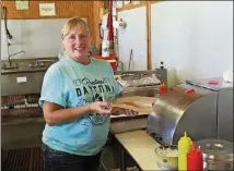  ?? BILL KING / SPECIAL ?? Jean Hancock has worked at the Colbert hot dog stand for nearly 17 years. “It’s the best job I ever had,” she said.