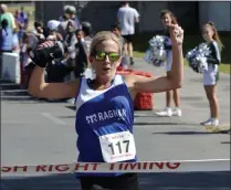  ?? STAN HUDY/THE SARATOGIAN ?? Rensselaer runner Shannon O’Meara crosses the finish line as the top female runner at Sunday’s Nick’s Fight to be Healed 5k in Clifton Park.