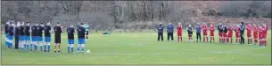  ??  ?? Tarbert and Easthall players hold a two minute applause before the game.