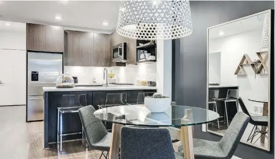  ?? PHOTOS: BUCCI DEVELOPMEN­TS ?? Guests visiting Bucci Developmen­ts’ A1 floor plan at Radius in Bridgeland can elbow up to the extended eating bar or stretch their legs in the dining area.