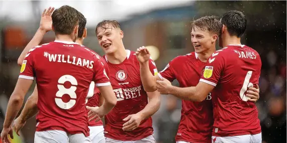  ?? Picture: Joe Giddens/PA ?? Bristol City’s George Tanner, second right, celebrates his goal againsnt Peterborou­gh