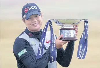  ??  ?? Ariya celebrates with the Ladies Scottish Open trophy.