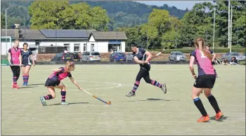  ?? 01_B36hockey0­4 ?? Captain Anne Watts strikes the ball in mid air.