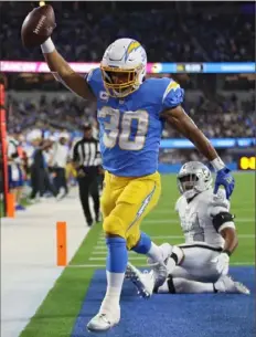  ?? Katelyn Mulcahy/Getty Images ?? Los Angeles Chargers running back Austin Ekeler ran for 117 yards and a touchdown, and caught another score in Monday's win over the Las Vegas Raiders at SoFi Stadium in Inglewood, Calif.