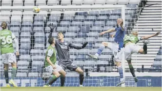  ??  ?? 0 Shaun Rooney heads home the winner for St Johnstone in the first half