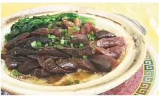  ??  ?? The Hong Kong-style claypot waxed meat rice is a great take on a classic dish.