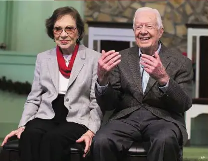  ??  ?? Cancer concerns Jimmy Carter with his wife, Rosalynn, at Maranatha Baptist Church in Plains, Georgia. A recent MRI showing no cancer on Carter’s brain is ‘very positive’ news for the former US president, but will not end his treatment, doctors said.
AP