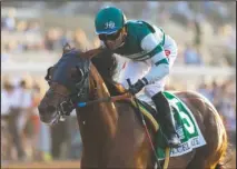  ?? The Associated Press ?? A PACIFIC CLASSIC: Accelerate and jockey Joel Rosario win the Grade 1 $1 million Pacific Classic Saturday at the Del Mar Thoroughbr­ed Club in Del Mar, Calif. Benoit Photo.