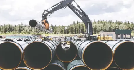  ?? JASON FRANSON/THE CANADIAN PRESS FILES ?? Latest figures say the cost to complete the twinning of the Trans Mountain pipeline will be $12.6 billion.