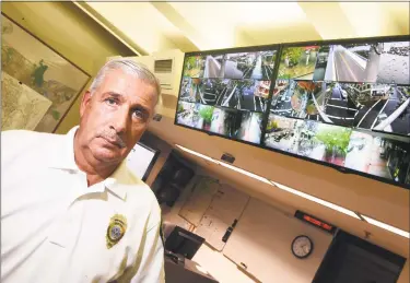  ?? Arnold Gold / Hearst Connecticu­t Media ?? New Haven Emergency Management Director Rick Fontana works in the Emergency Operations Center in New Haven with monitors of various camera views from across the city last week.