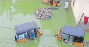  ?? AP ?? Auto-rickshaws are partially submerged in a flooded street after heavy rainfall in Hyderabad on Wednesday.