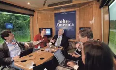  ?? ASSOCIATED PRESS ?? Republican Sen. John McCain talks with reporters as he drives from Hudson to Altoona while campaignin­g in Wisconsin in 2008 in his Straight Talk Express bus.